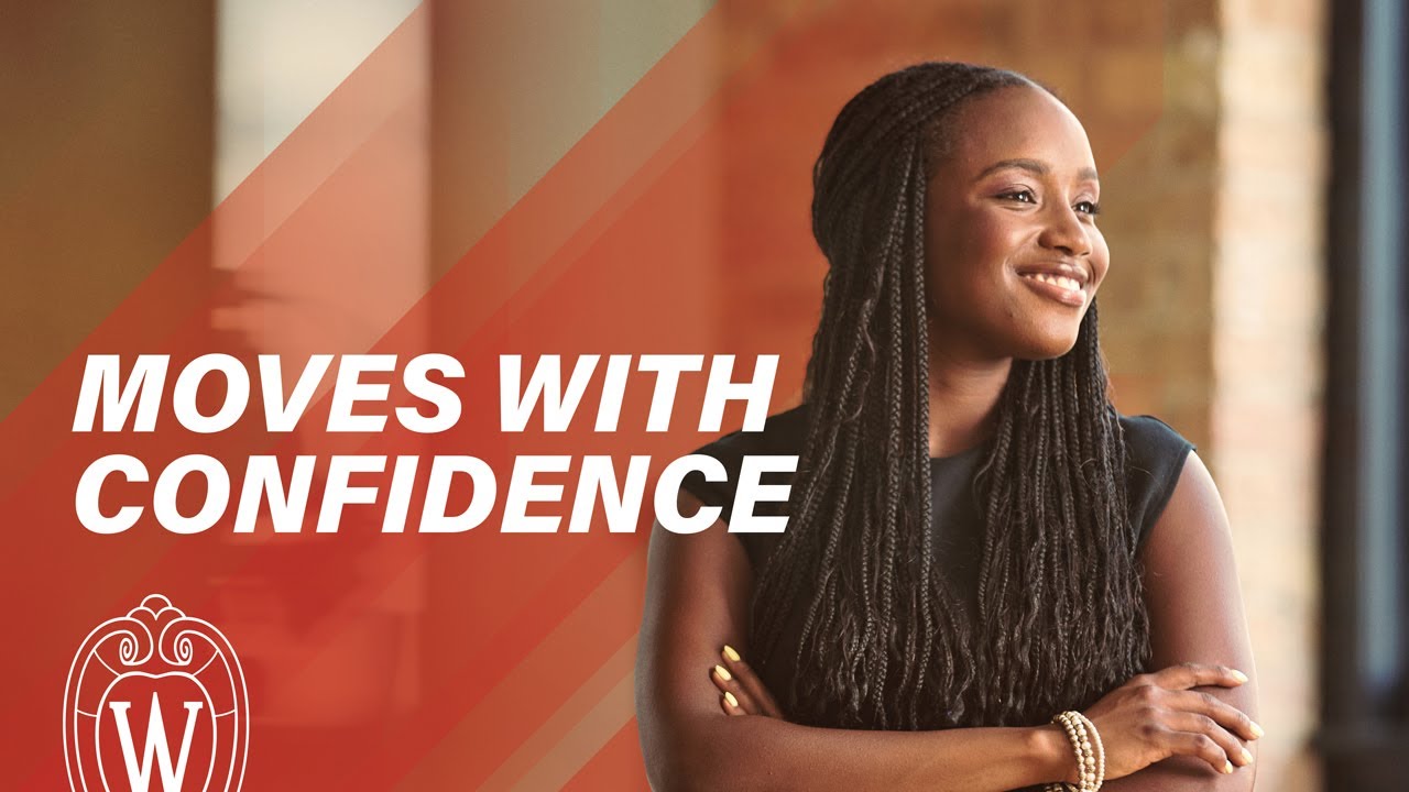 Young black woman smiling with arms crossed, text says "moves with confidence"