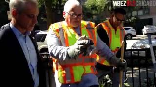 Rahm Emanuel watches city employees put dry ice into rat burrows
