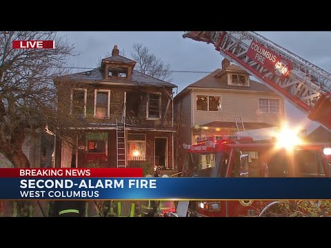 Crews fight second-alarm fire in two homes