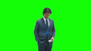 Mark S. waiting and checking his watch — Severance green screen