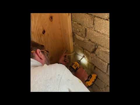 Adding an electrical outlet to a compressed earth block (CEB) wall