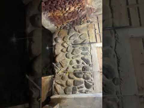 An open-air bath and a river seen from the bath at an Japanese onsen ryokan. (Nasushiobara Onsen)