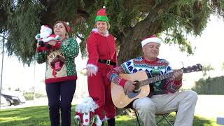 Song: Must be Santa by Raffi, sung by Toby, Mimi, and Michelle