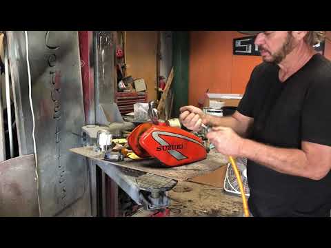 Removing dents from motorcycle gas tank with a water bottle