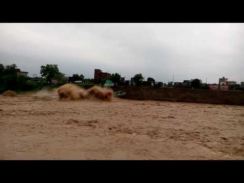 Suspension bridge collapses during a massive flood