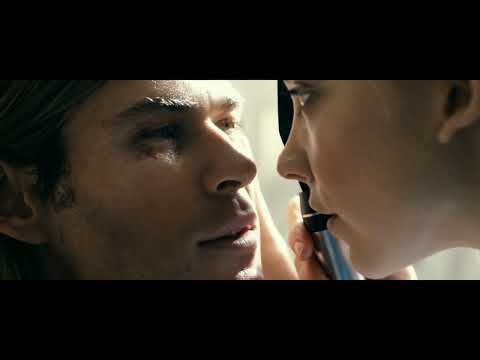 Trailer close-up — Lauda’s eyes through the visor while a dry, clicking pulse builds