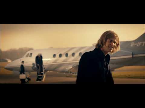 Rush trailer still — Hunt and Lauda on the grid as synth pulses rev like engines