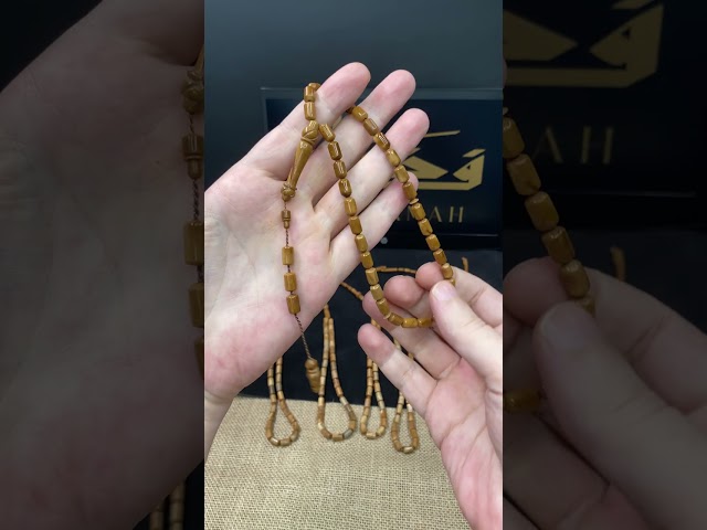 سبحة كوك طبيعي بحبات صغيرة أسطوانية وشرابة سيستملي