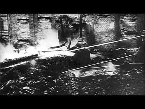 Paul Joseph Goebbels and other officers inspect bomb damaged buildings after Alli...HD Stock Footage