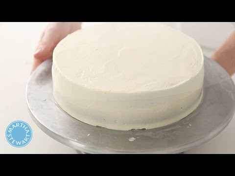 Part of a video titled How to Crumb-Coat a Cake with Martha Stewart - YouTube