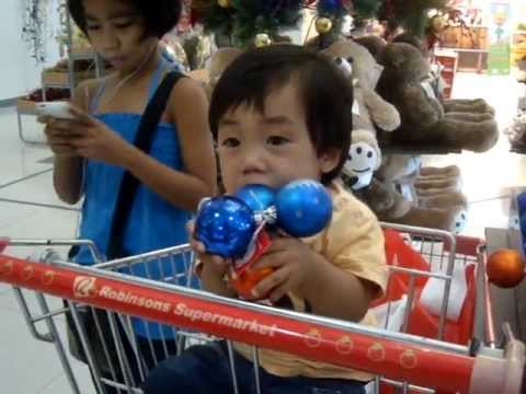 Seth Ezekiel aka PJ aka Pepito John playing with Christmas balls