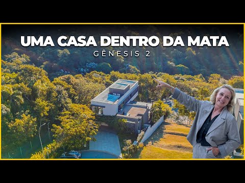 Casa contemporânea com vista para o lago e mata preservada no Gênesis 2