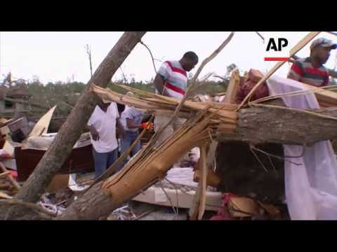 Emergency crews searched for survivors Monday in the debris left by a powerful tornado that killed a