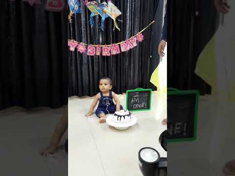 Cake Smash at 1st birthday, enjoying cake for the first time!