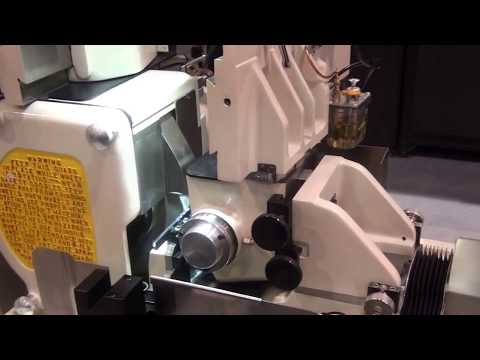 TG-12x4 Servo Cycle Centerless grinder making a coronary guidewire with a diameter of .002"