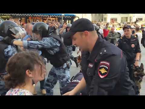 Russian protesters beaten by police