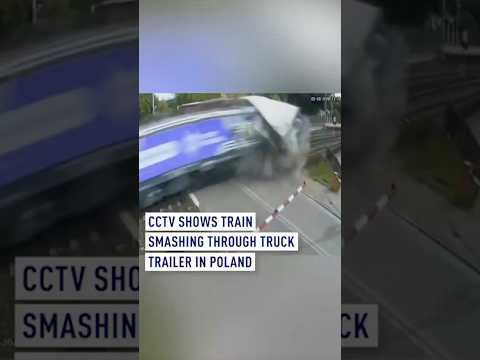 CCTV shows train smashing through truck trailer in Poland