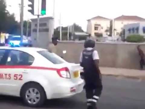 Jamaican Mad Man Attacks Jamaican Police With Machete JULY 2013.