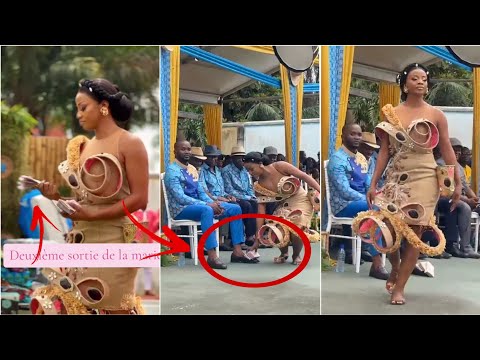 Bride walks up to her groom and drops her Bride Price right at his feet
