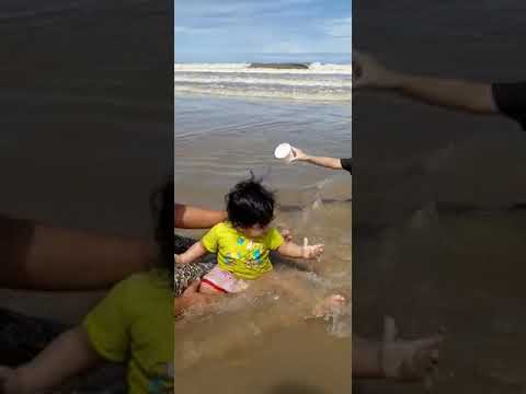 vaisu playing in beach