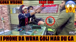 Daka with fake gun in I PHONE 13 PRO MAX shop Gona