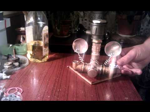Vegetable oil lamp with two argand burners, filling and turning on