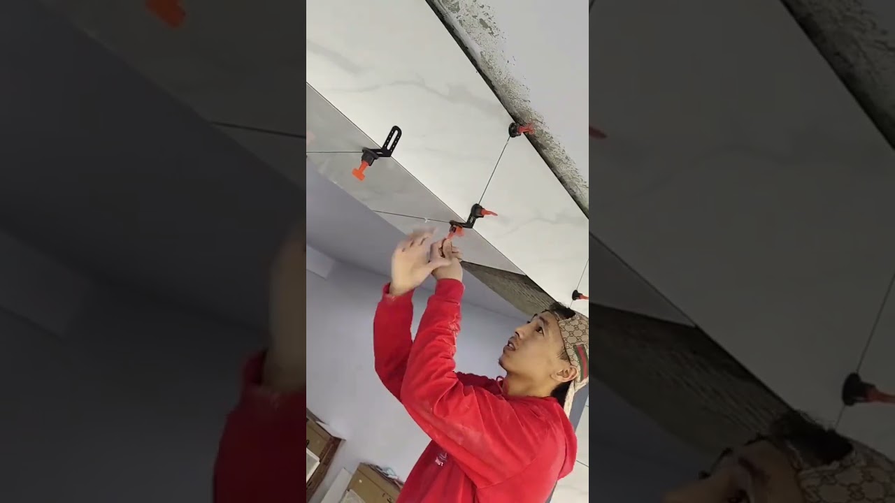 New tools: Bricklayer laying ceramic tiles, master tiles, bricklayer tools, leveling machines