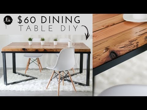 Part of a video titled OUR DIY Scandinavian Dining table | Wood & Metal | Recycled Wood
