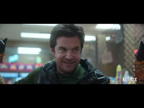 Trailer collage: grocery-aisle melee, diner standoff with Laser, and the duo’s rooftop stance