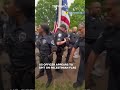 US police officer appears to be spitting on Palestinian flag