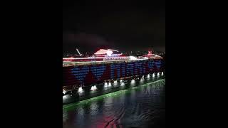 A triumphant arrival in the dark! The luminous Virgin Valiant Lady lights up PortMiami.