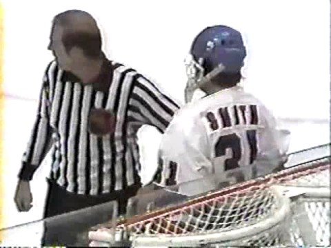 Billy Smith highsticks Lindy Ruff in the eye