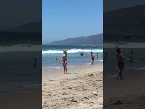 Jenna Bandy throws vortex nerf football across the beach