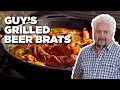 Guy Fieri's Grilled Beer Brats with Peppers and Onions | Guy's Big Bite | Food Network