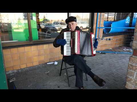 Old Russian man playing the accordion