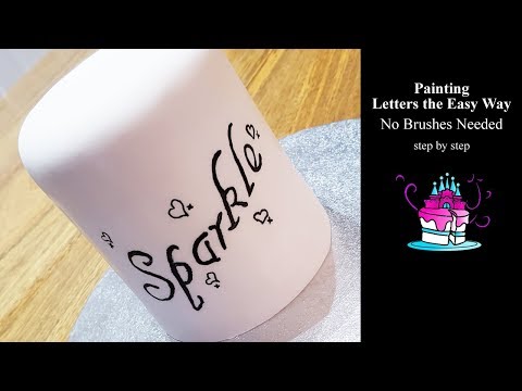 Part of a video titled Painting Letters on Cake the Easy Way - No Brushes Needed - YouTube