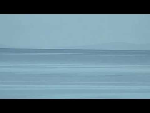 The hills of Harris Clisham etc from Big Sand near Gairloch Scotland UK