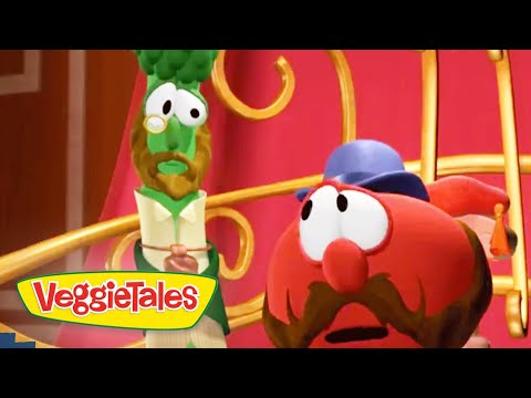 Two VeggieTales characters on a colorful stage, a green veggie with glasses and bow tie beside a red, mustached veggie in a blue hat, looking surprised.