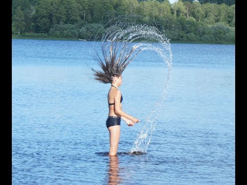 Siblings happy children bath in lake Ryssbysjön Småland Sweden sea