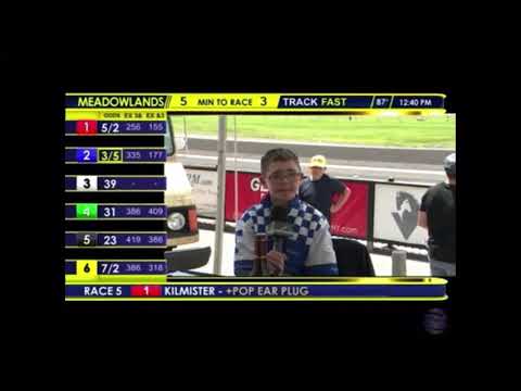 Justin getting interviewed with Jessica Otten during Hambletonian Day 2022