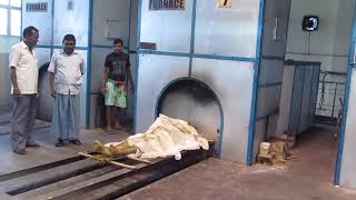 Burning dead body in electric furnace...