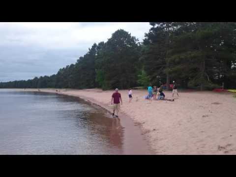 View of the beach in June 2016. This is a school of loons with its mother out on the lake just in front of all of us! 