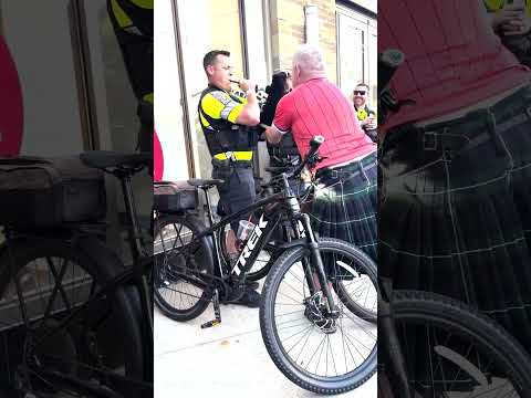 Boston police officer attempts bagpipes for Scottish World Cup fans