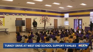 Former UofL star Josh Minkins leads Thanksgiving giveaway at West End School