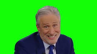 Jon Stewart stares at the camera and shrugs green screen
