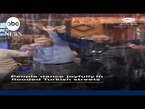 People dance joyfully in flooded Turkish streets