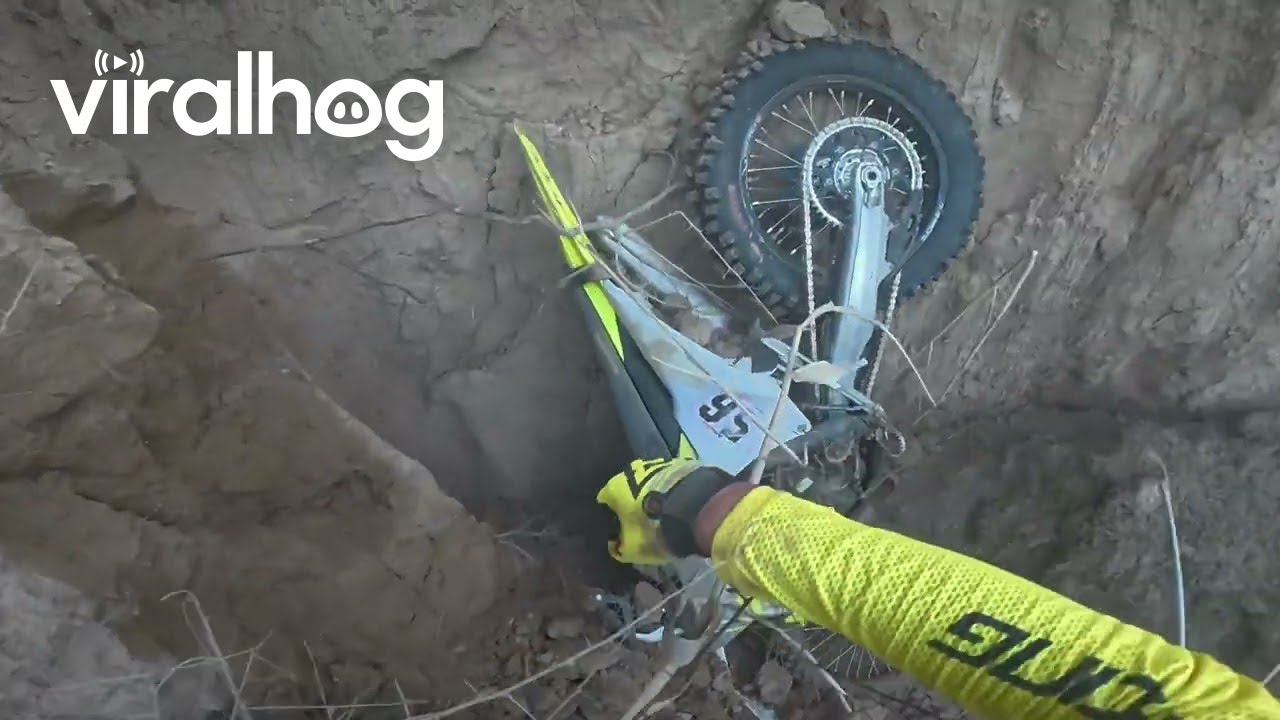 Dirt Bike Goes Over Cliff, Rider Does Not || ViralHog