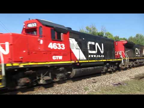 CN 3855, 3074, 5648, 2190, GTW 4633, 4623 haul an Eastbound freight train in Vicksburg, MI