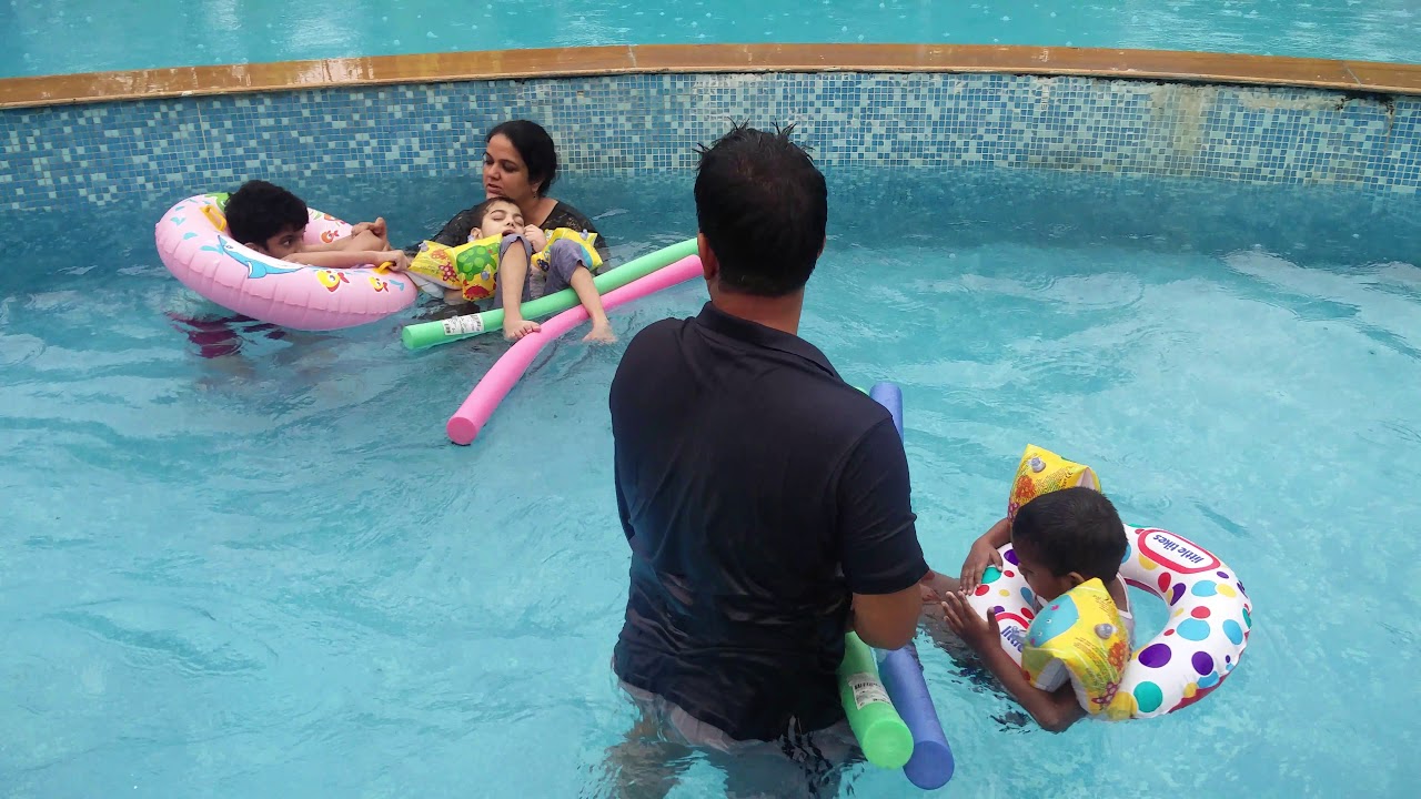 Three girls swimmmg