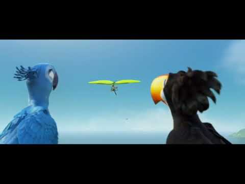 Trailer image: Blu and Jewel mid-flight over Rio at sunset, echoing 'Mas Que Nada' placement